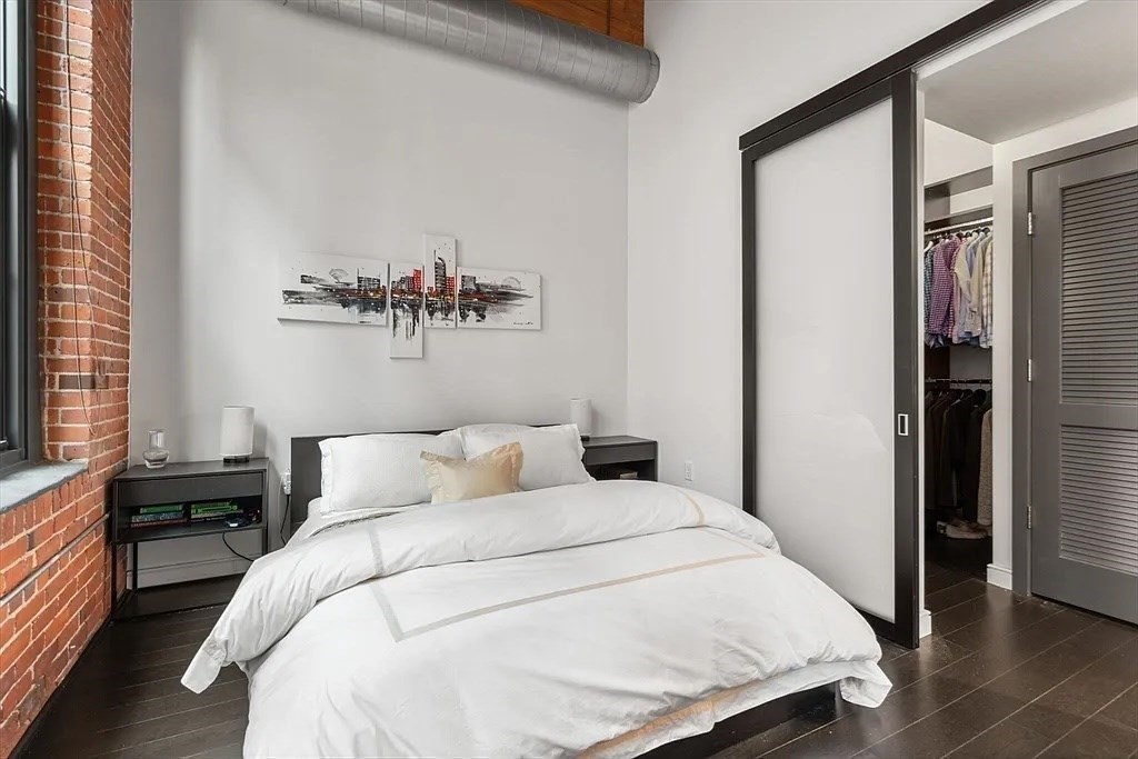 319 A Street, Unit 307 Boston, MA 02210 - Photo 4 of 25 a bedroom with a bed and window