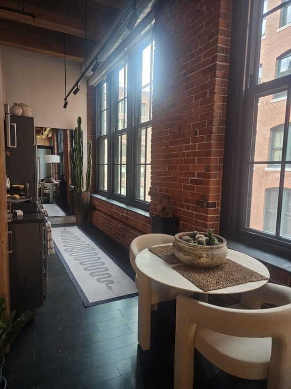 319 A Street, Unit 307 Boston, MA 02210 - Photo 10 of 25 a dining room with furniture and window