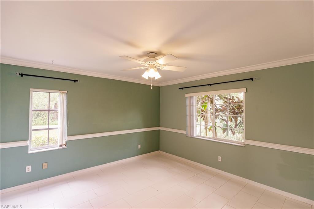 121 Gabriel Circle, Unit 1111 Naples, FL 34104 - Photo 22 of 34 a view of an empty room with a window