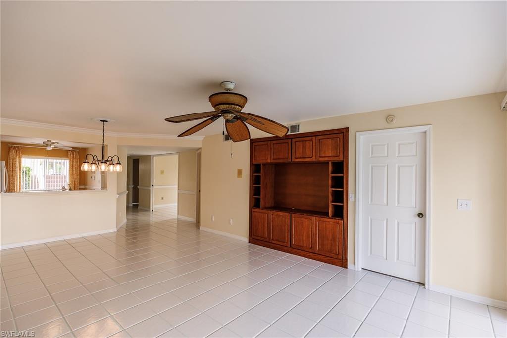 121 Gabriel Circle, Unit 1111 Naples, FL 34104 - Photo 4 of 34 a view of a livingroom with wooden floor