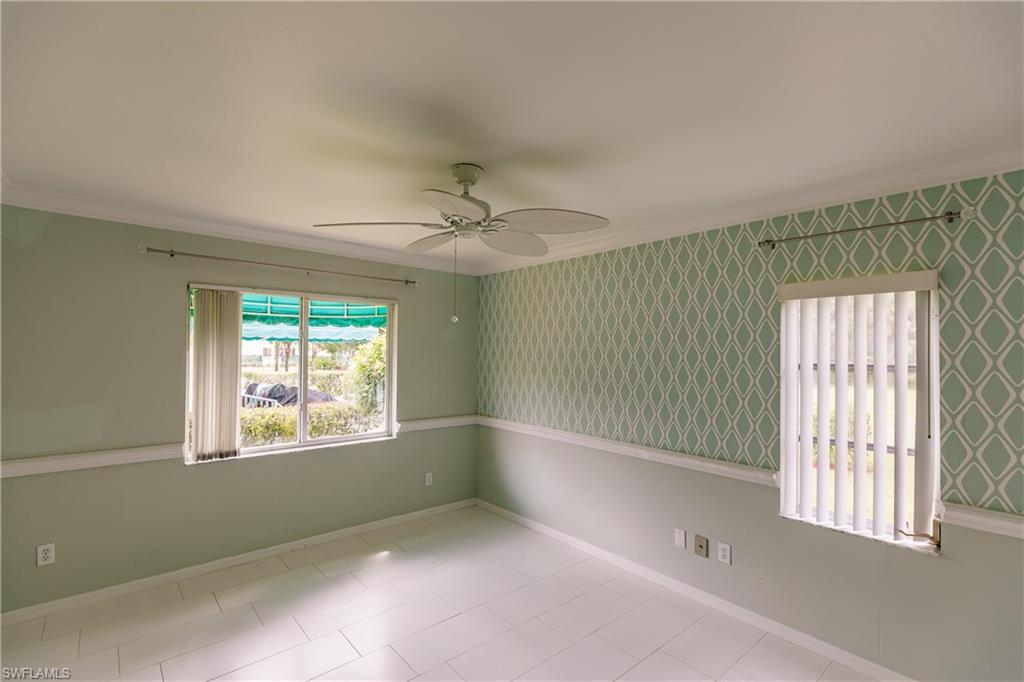 121 Gabriel Circle, Unit 1111 Naples, FL 34104 - Photo 7 of 34 a view of an empty room with a window