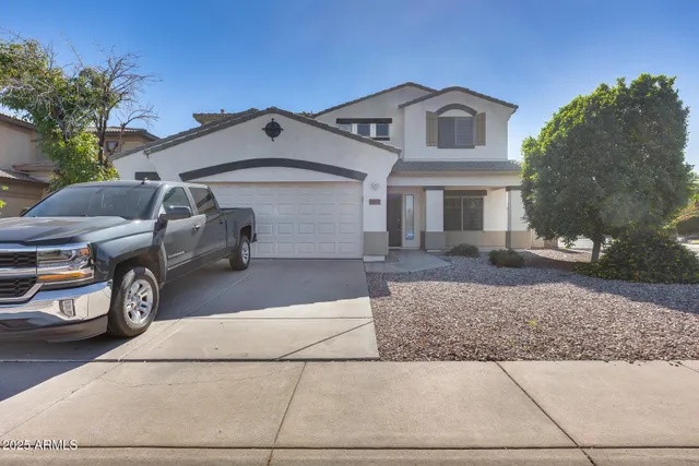 a view of a car parked in front of a house