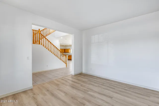 a view of an entryway with wooden floor