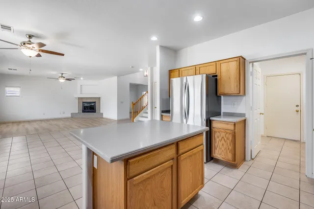 a kitchen with stainless steel appliances a sink and a refrigerator