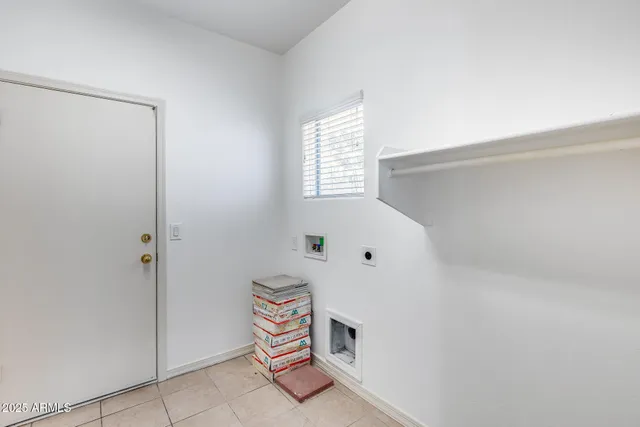 a room with a table and a painting