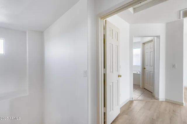 a view of a bathroom from the hallway