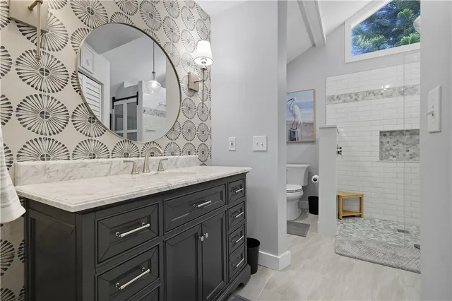 a bathroom with a shower and toilet