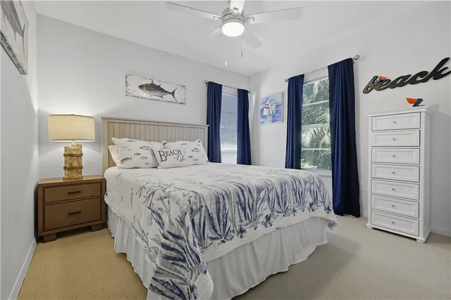 a bathroom with a granite countertop bathtub sink vanity mirror and toilet