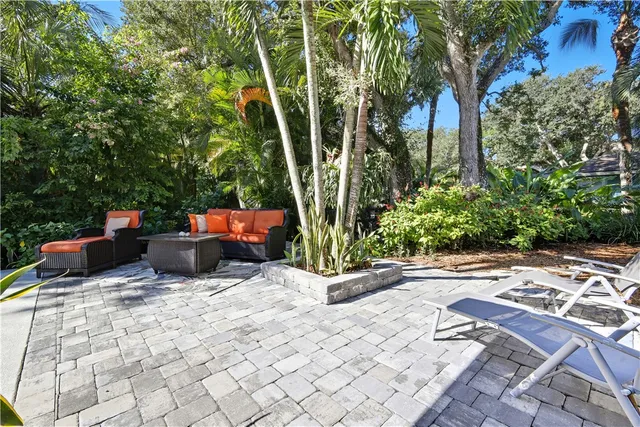 a view of a backyard with pathway