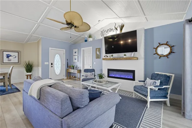 a kitchen with sink cabinets and wooden floor