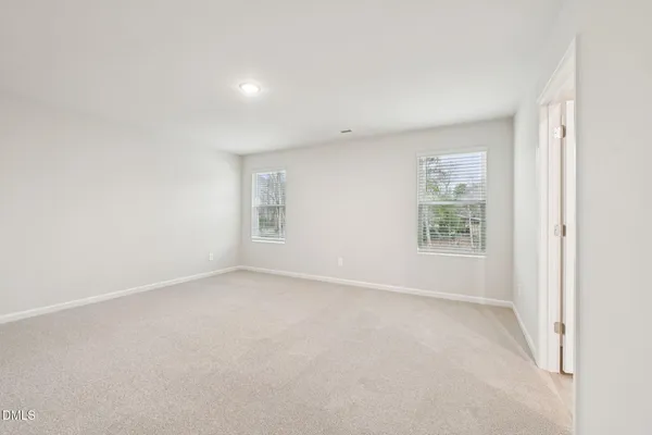a bathroom with double sink and a mirror