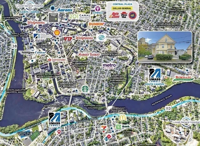 a view of a white house next to a yard