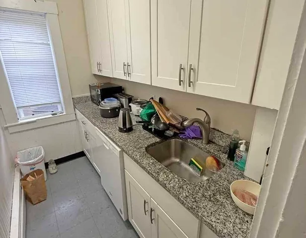 a room with furniture and a window