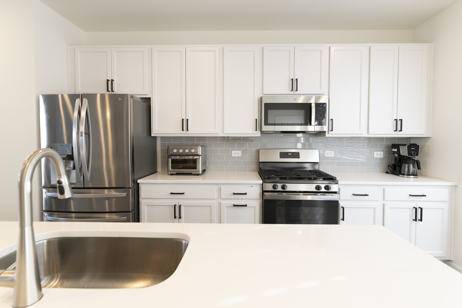 3316 Trillium Circle Rolling Meadows, IL 60008 - Photo 11 of 27 a kitchen with stainless steel appliances granite countertop a refrigerator stove top oven a sink and dishwasher