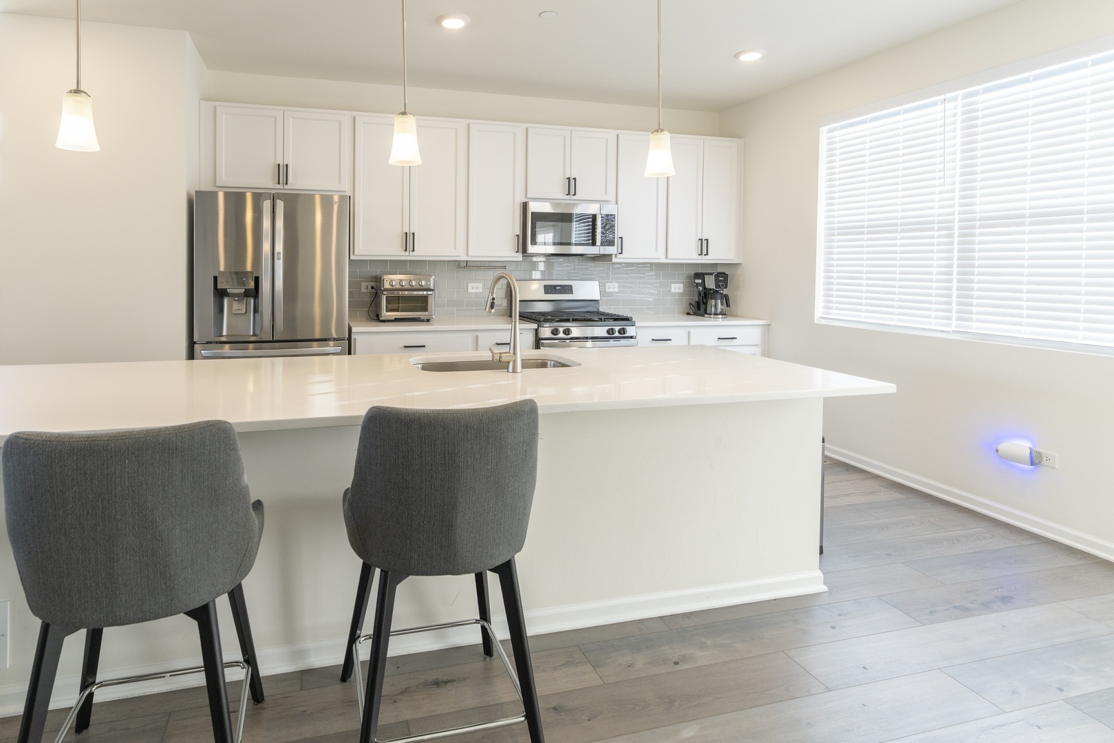 3316 Trillium Circle Rolling Meadows, IL 60008 - Photo 12 of 27 a kitchen with stainless steel appliances granite countertop a stove a sink a refrigerator and a refrigerator