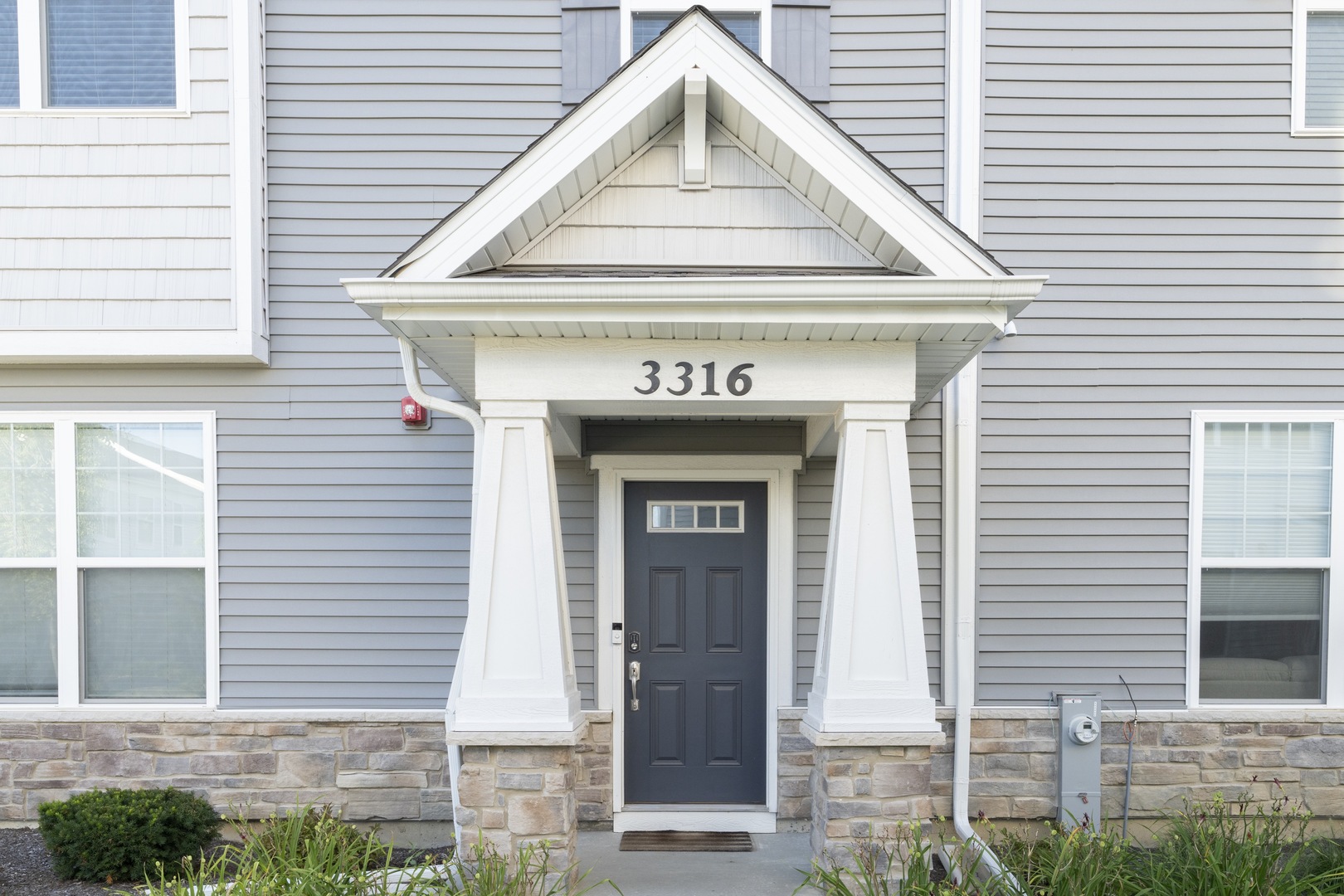 3316 Trillium Circle Rolling Meadows, IL 60008 - Photo 2 of 27 a view of brick house with large windows