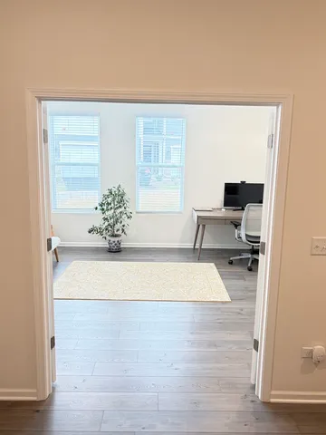 a white bath tub sitting in a en suite bathroom