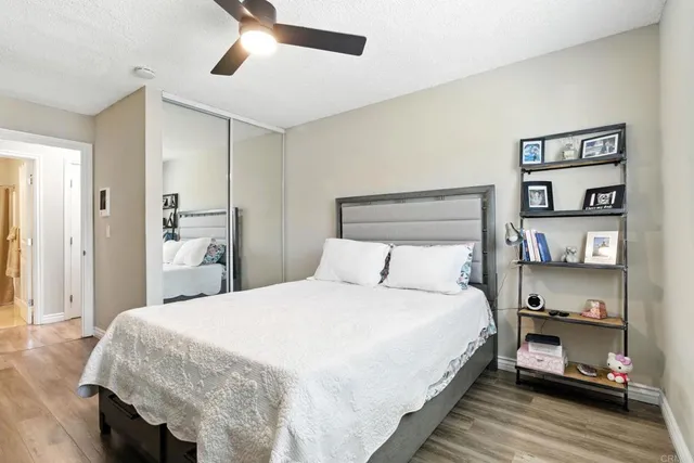 a bedroom with a bed and a book shelf