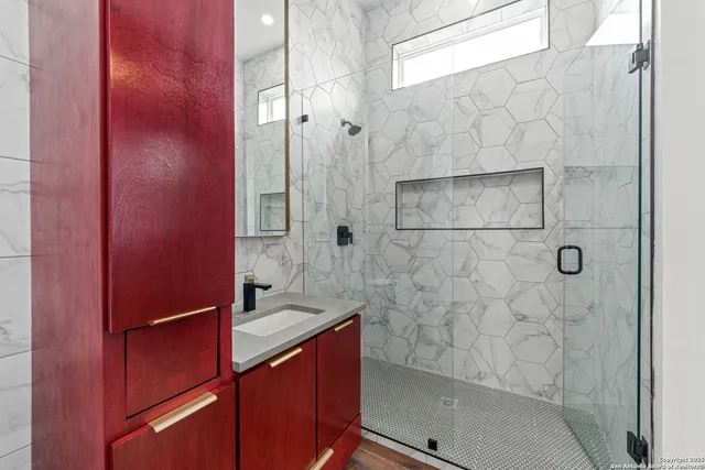 a bathroom with a bathtub and a shower