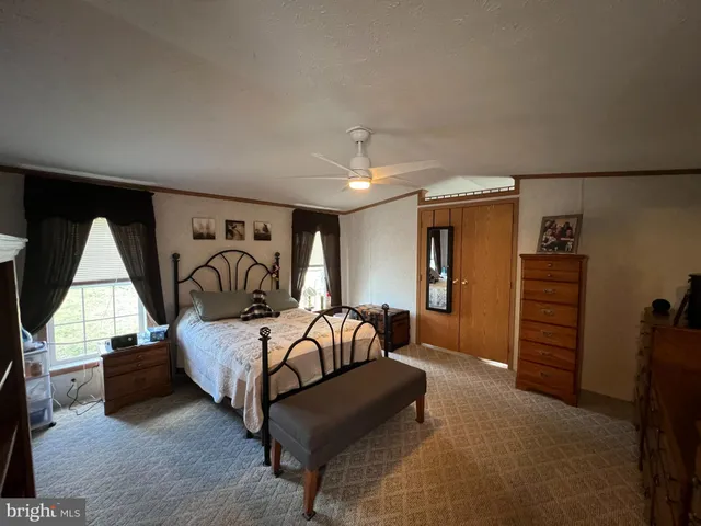 a bedroom with furniture and window