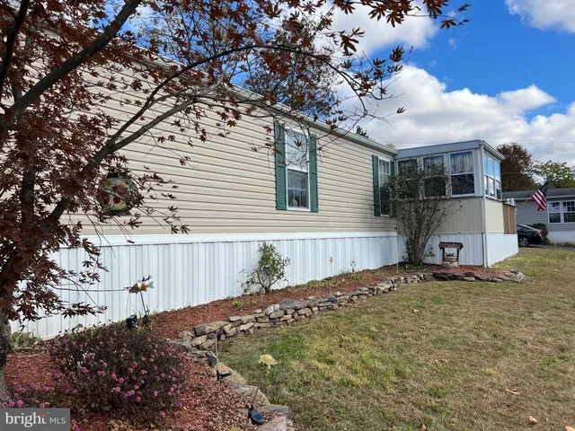 a view of a house with a snow in the yard