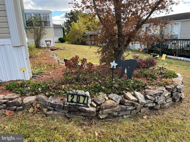 a view of a backyard with sitting area