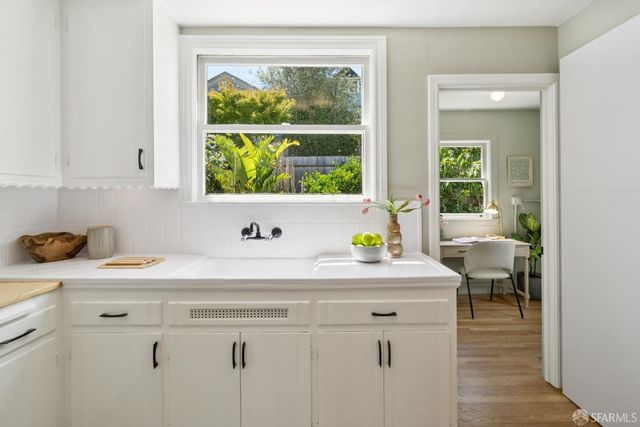 a view of a kitchen with a window