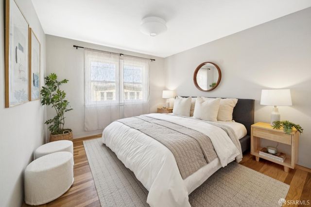 a bedroom with bed and a window