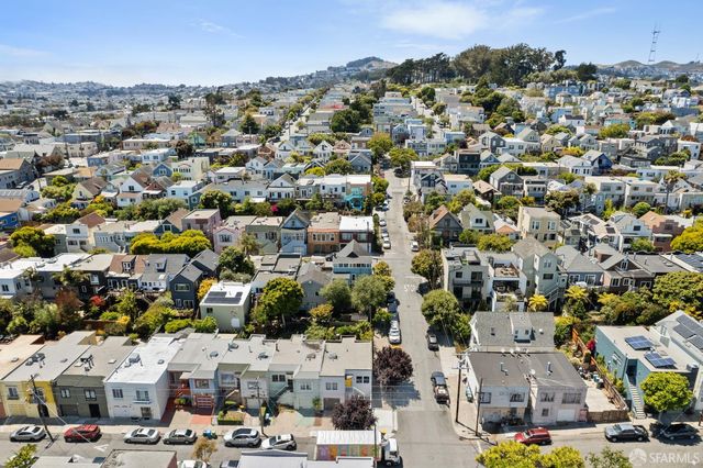 a view of path along with retail shop and buildings
