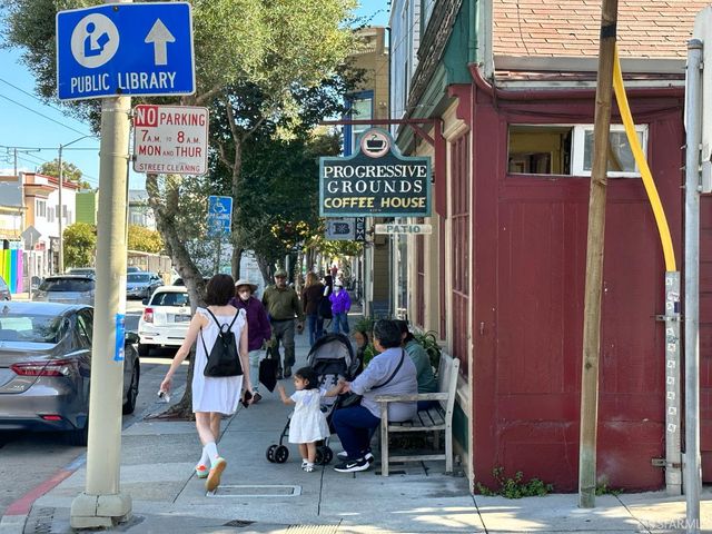 an aerial view of a house with a street