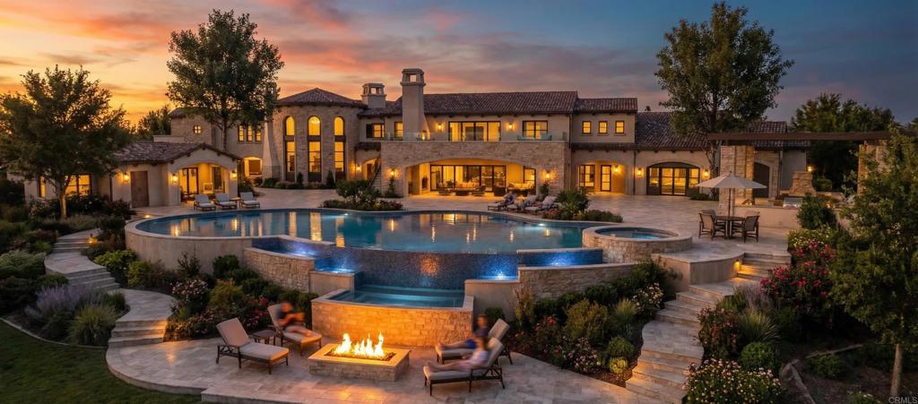 a view of a house with swimming pool and sitting area