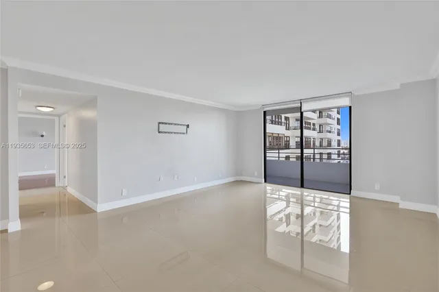 a kitchen with stainless steel appliances kitchen island granite countertop a stove a sink and a refrigerator