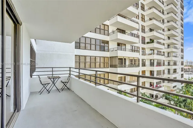 a view of swimming pool with outdoor seating and plants