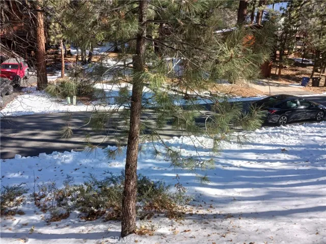 a view of house with a yard
