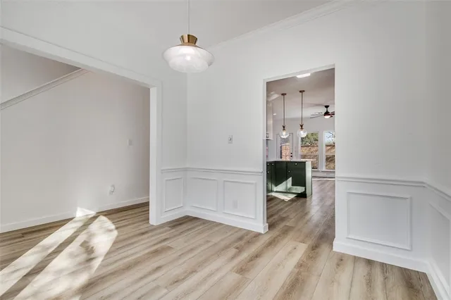 wooden floor in kitchen with white walls and wooden floor