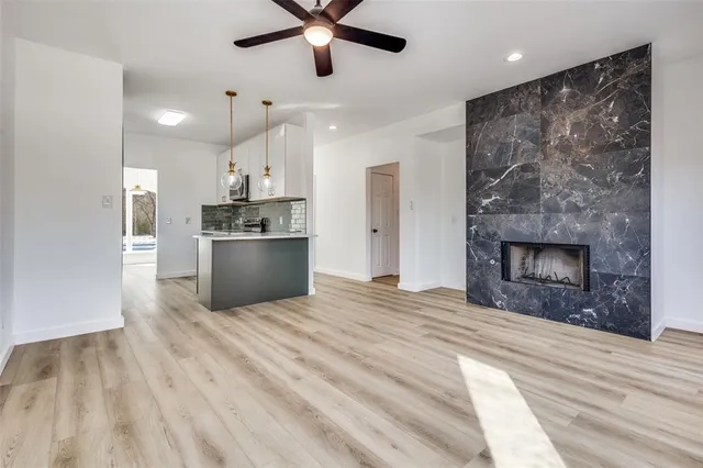 a large kitchen with cabinets and stainless steel appliances