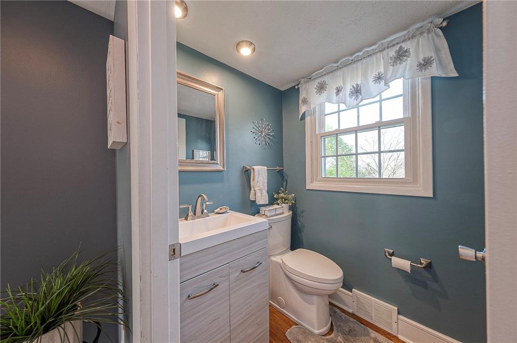 114 Truman Street Monaca, PA 15061 - Photo 14 of 30 a bathroom with a sink a toilet and window