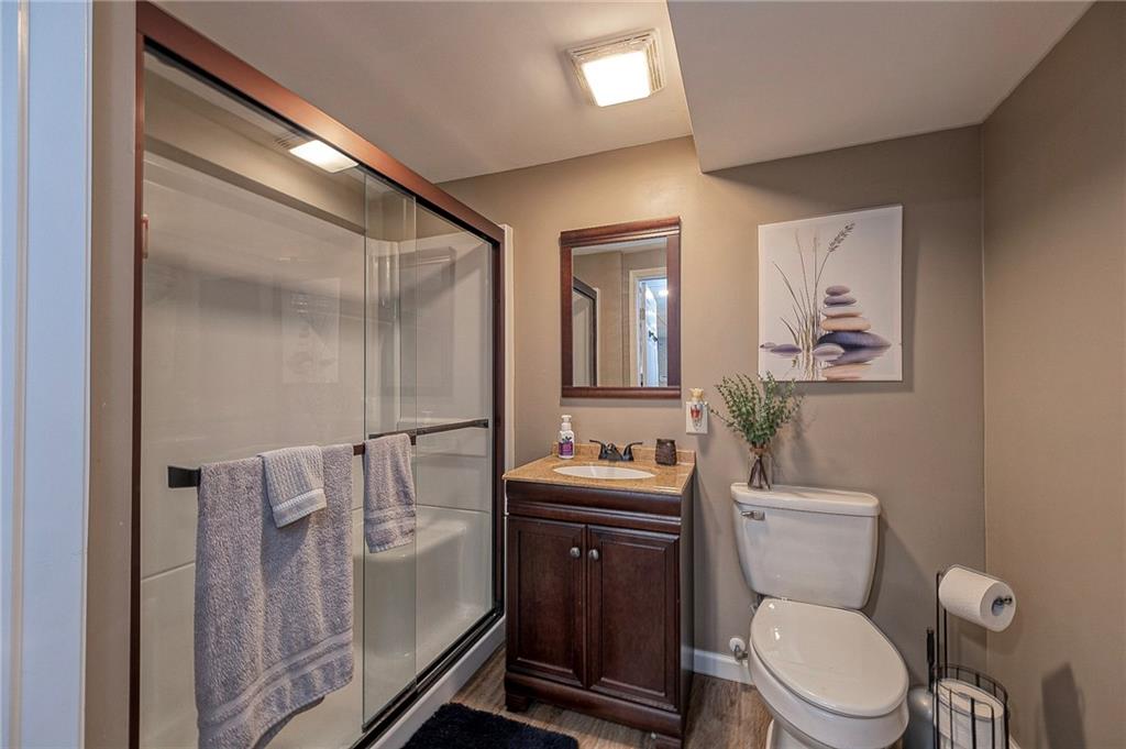 114 Truman Street Monaca, PA 15061 - Photo 20 of 30 a bathroom with a toilet a sink and mirror