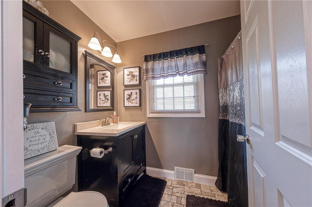 114 Truman Street Monaca, PA 15061 - Photo 23 of 30 a bathroom with a sink a toilet and shower