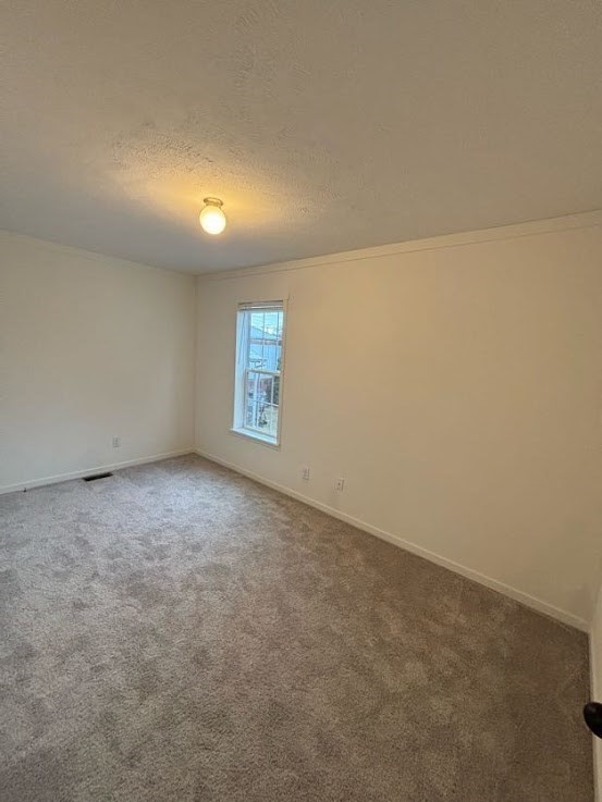 557 Southwest Cutoff, Unit 90 Worcester, MA 01607 - Photo 11 of 12 an empty room with windows