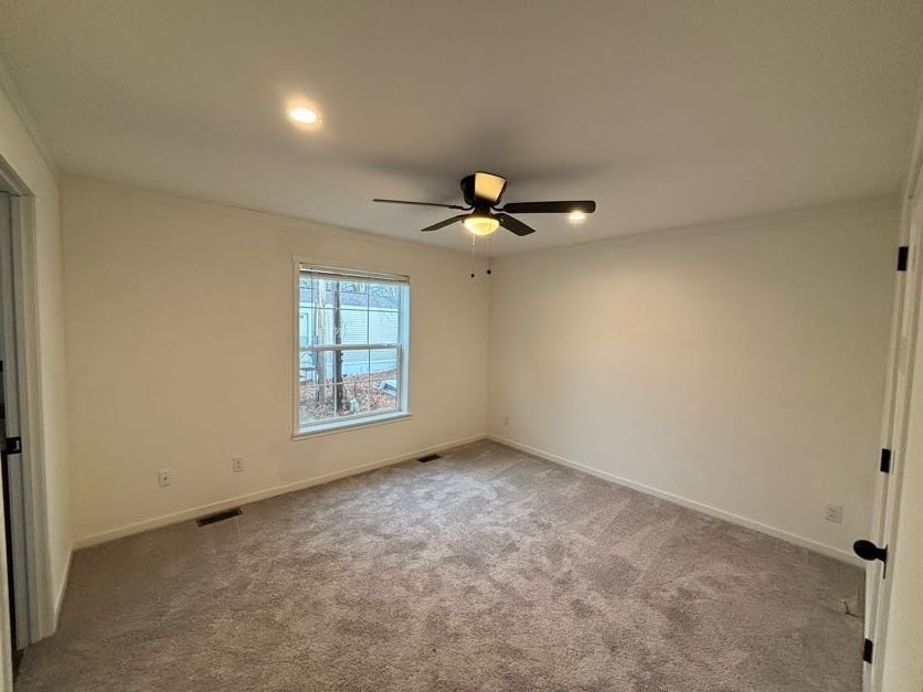 557 Southwest Cutoff, Unit 90 Worcester, MA 01607 - Photo 7 of 12 a view of an empty room with a window