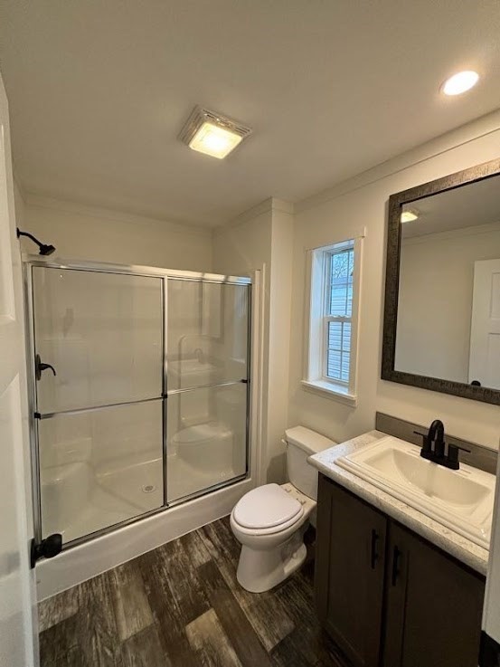 557 Southwest Cutoff, Unit 90 Worcester, MA 01607 - Photo 8 of 12 a bathroom with a sink toilet a mirror and shower
