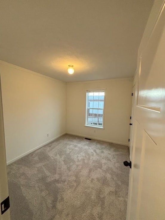 557 Southwest Cutoff, Unit 90 Worcester, MA 01607 - Photo 9 of 12 an empty room with windows