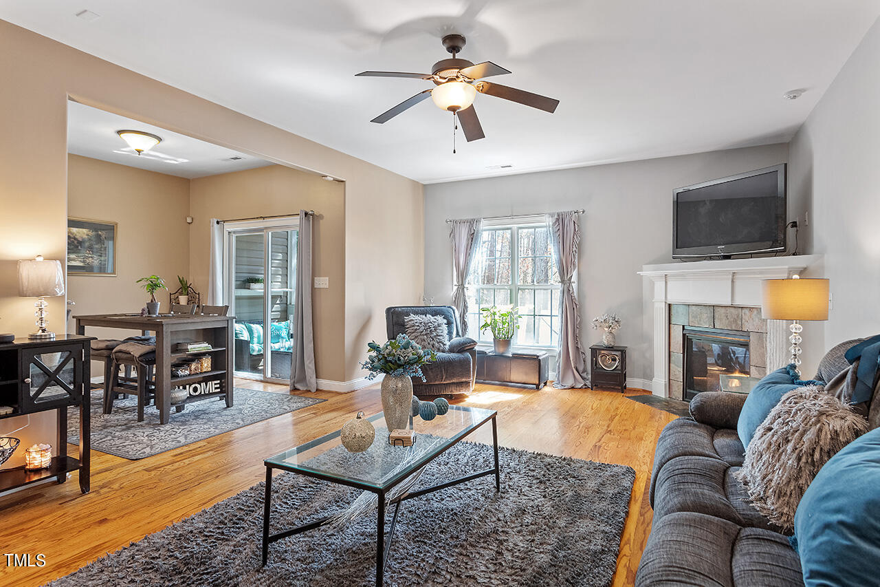 4628 Pat Reed Road Raleigh, NC 27616 - Photo 1 of 34 a living room with furniture fireplace and a flat screen tv