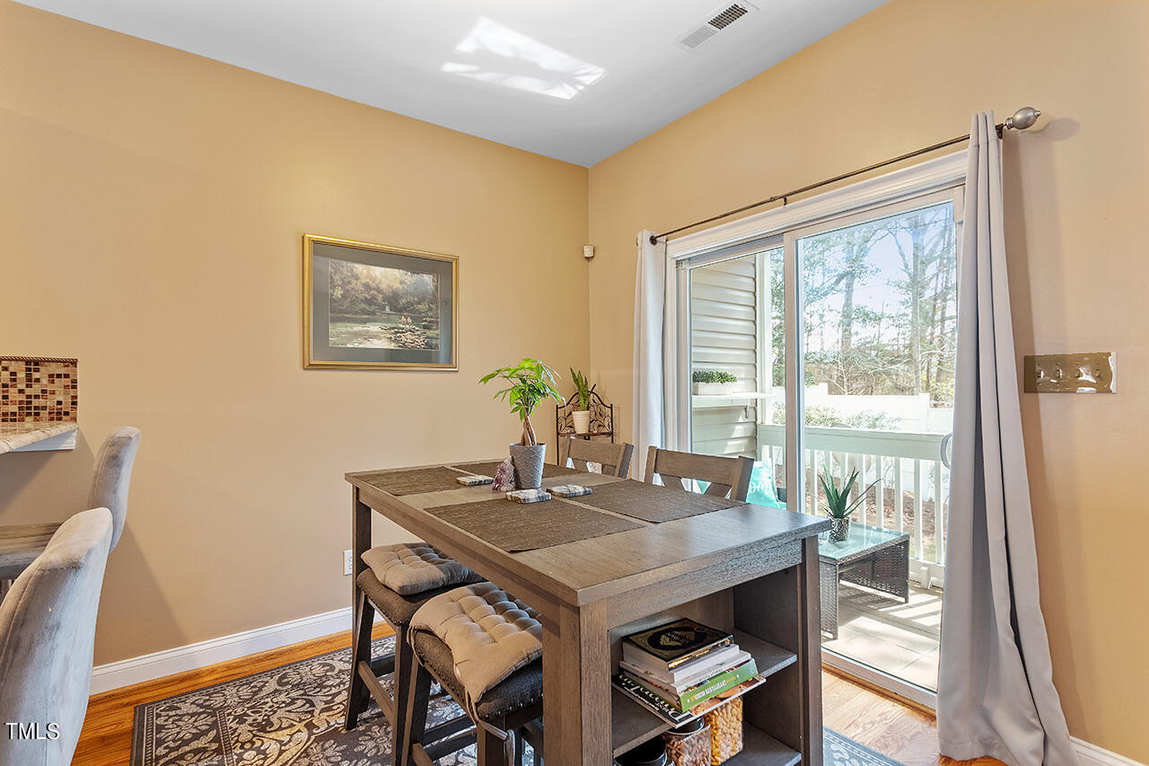 4628 Pat Reed Road Raleigh, NC 27616 - Photo 14 of 34 a view of a workspace with furniture and a table