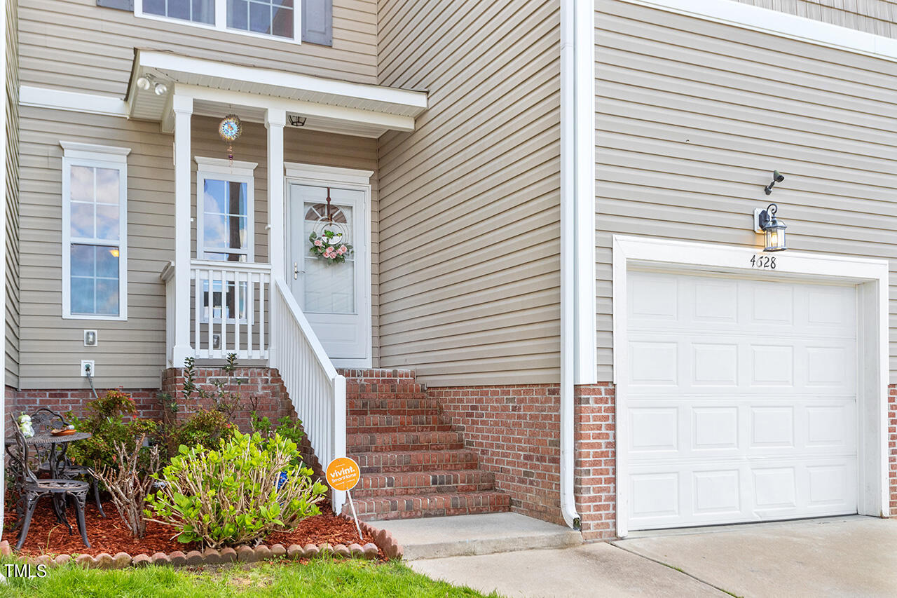 4628 Pat Reed Road Raleigh, NC 27616 - Photo 2 of 34 a front view of a house with garden