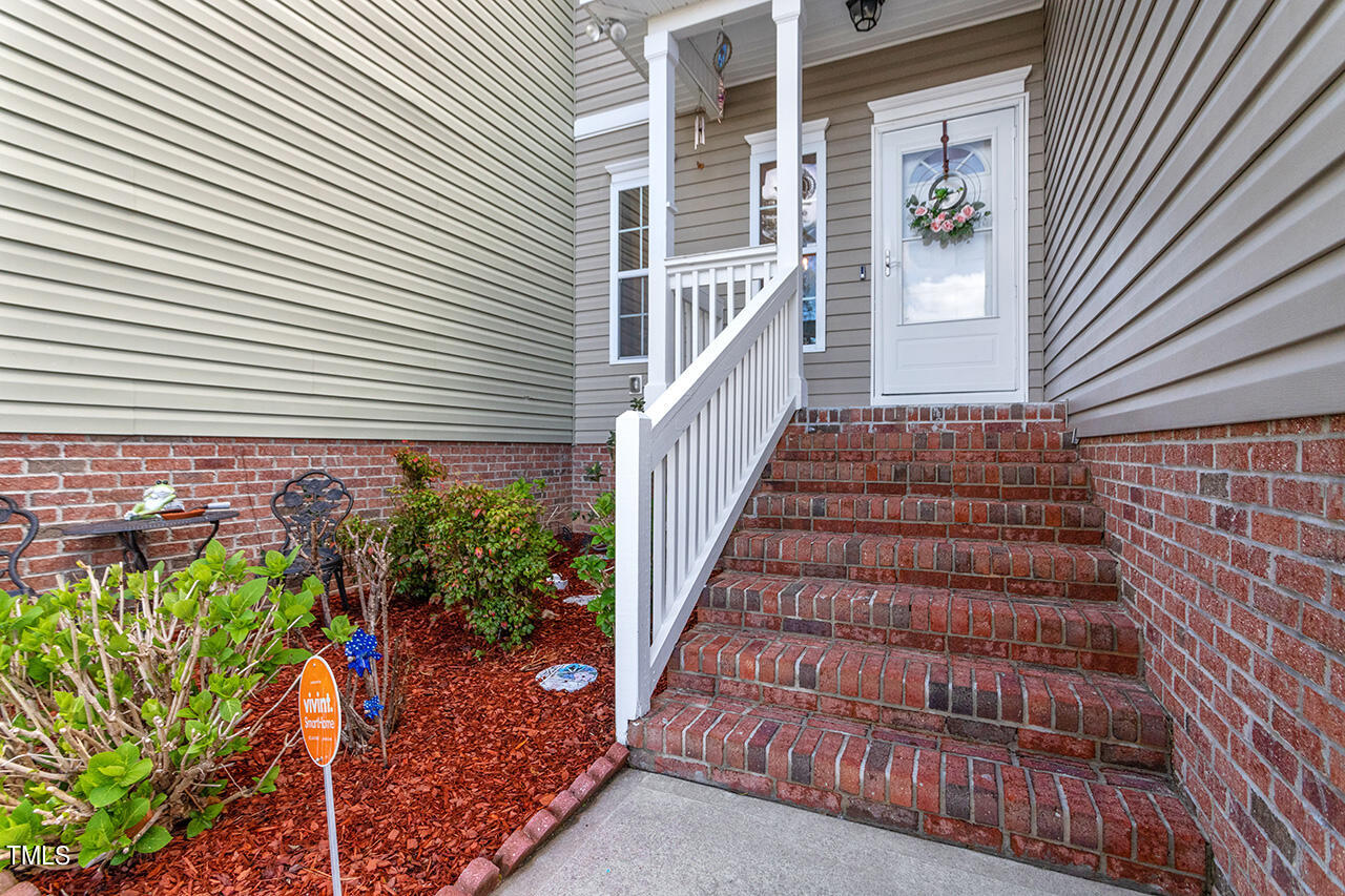 4628 Pat Reed Road Raleigh, NC 27616 - Photo 6 of 34 a view of a house with a flower plants
