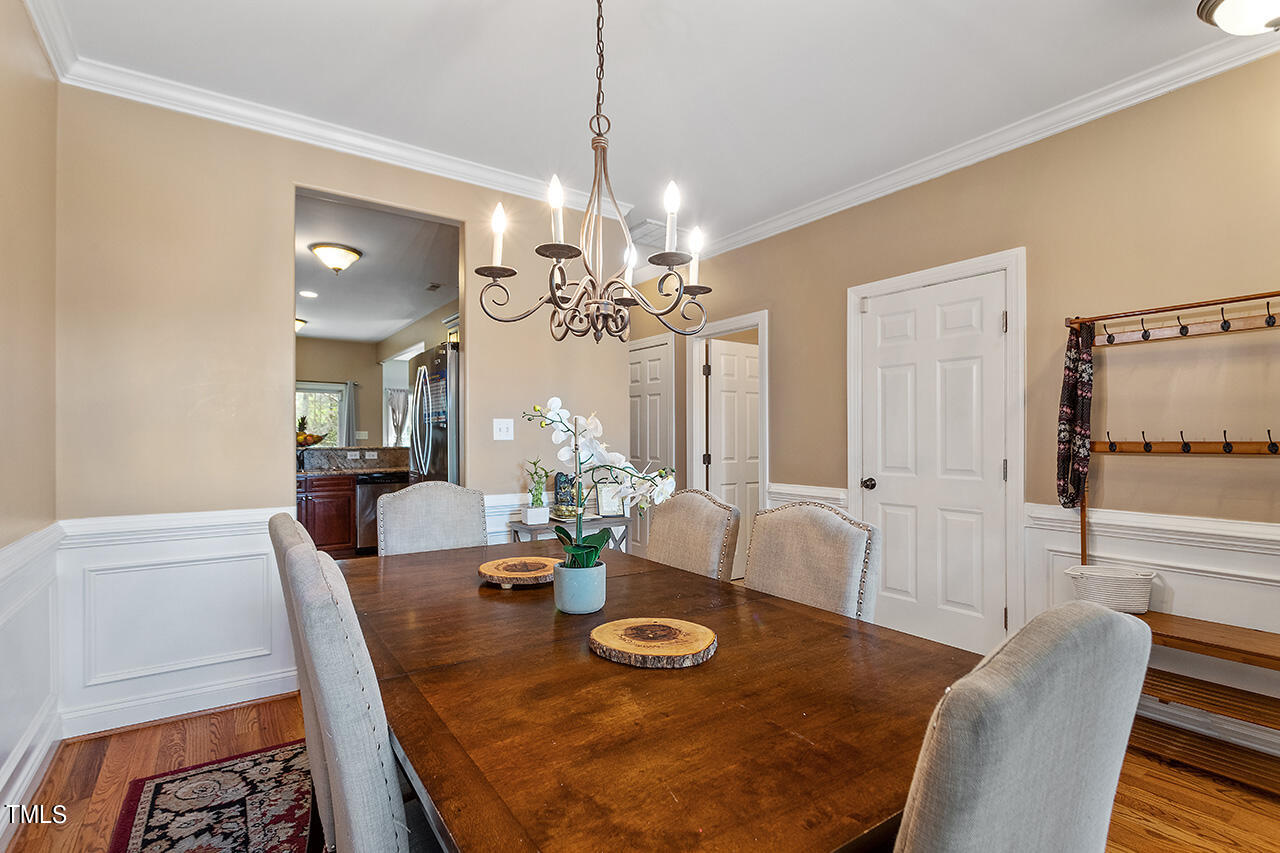 4628 Pat Reed Road Raleigh, NC 27616 - Photo 9 of 34 a view of a dining room with furniture