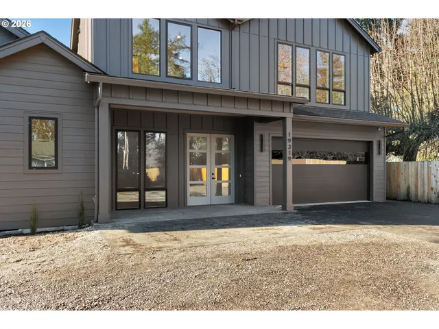 a view of a house with a door and wooden walls