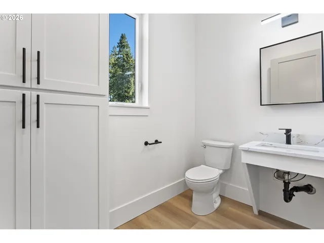 a bathroom with a toilet and a sink